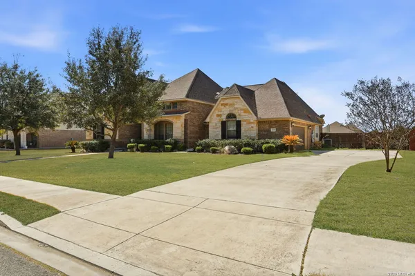 a front view of a house with a yard