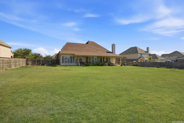 a front view of house with yard and green space
