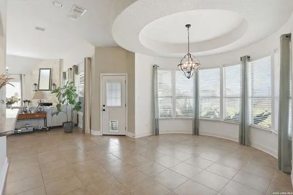 a spacious bedroom with a balcony a bed and a couch