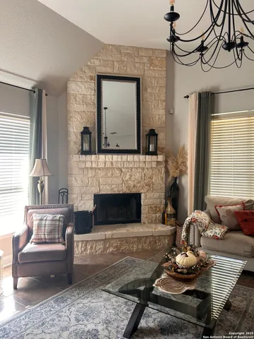 a living room with furniture and a fireplace