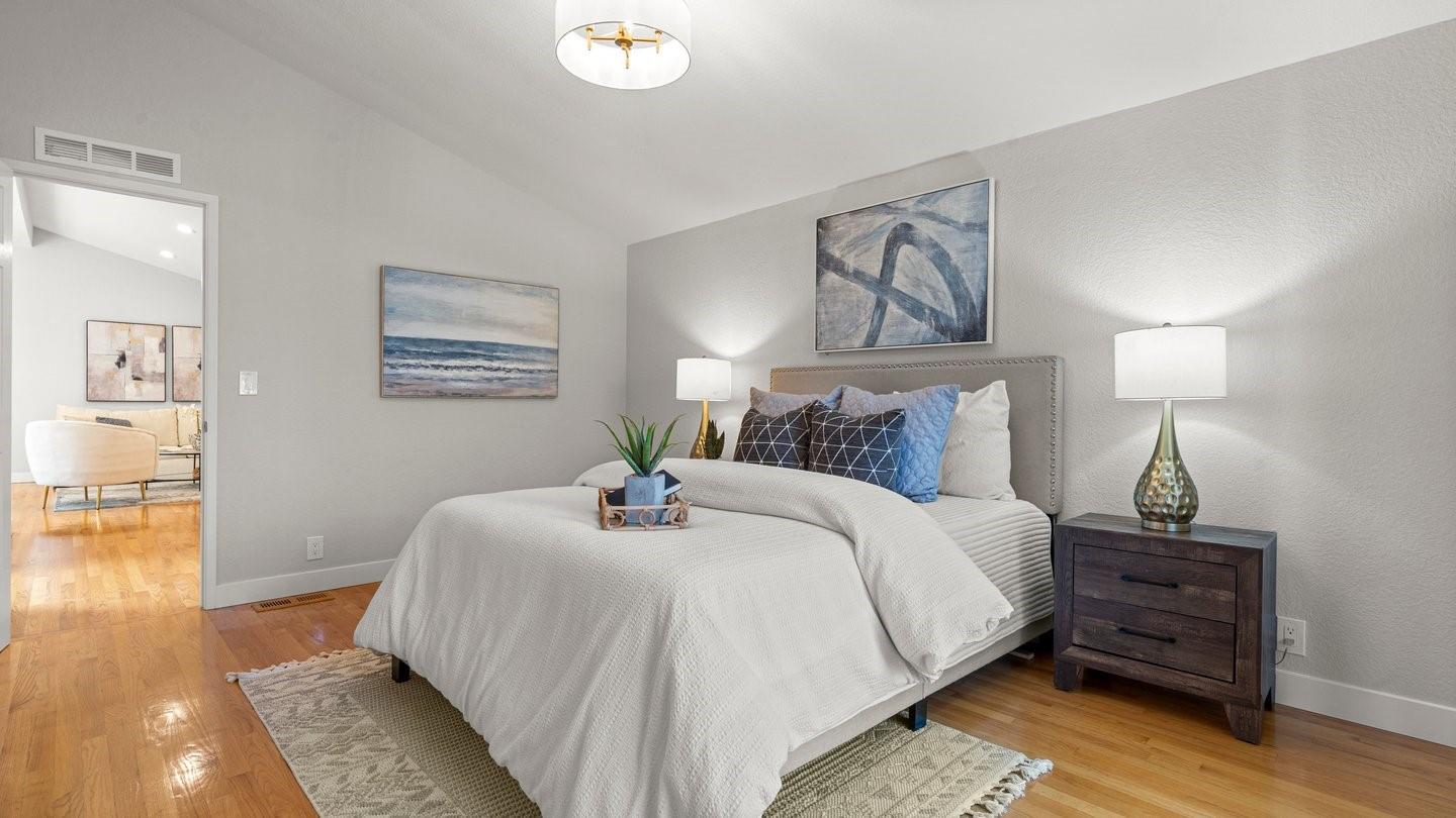14355 La Rinconada Drive Los Gatos, CA 95032 - Photo 19 of 42 a bedroom with a bed and wooden floor