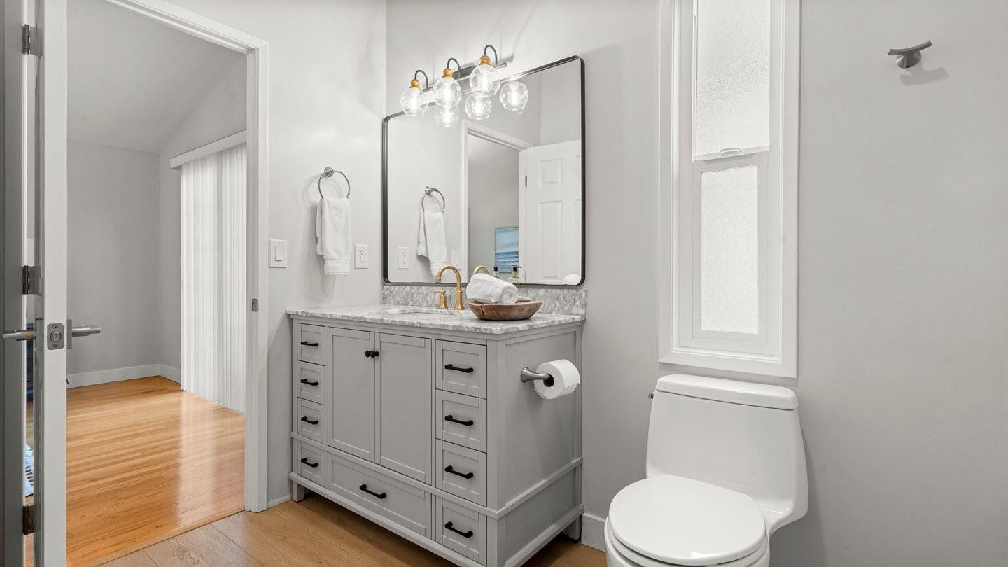14355 La Rinconada Drive Los Gatos, CA 95032 - Photo 21 of 42 a bathroom with a double vanity sink toilet and shower