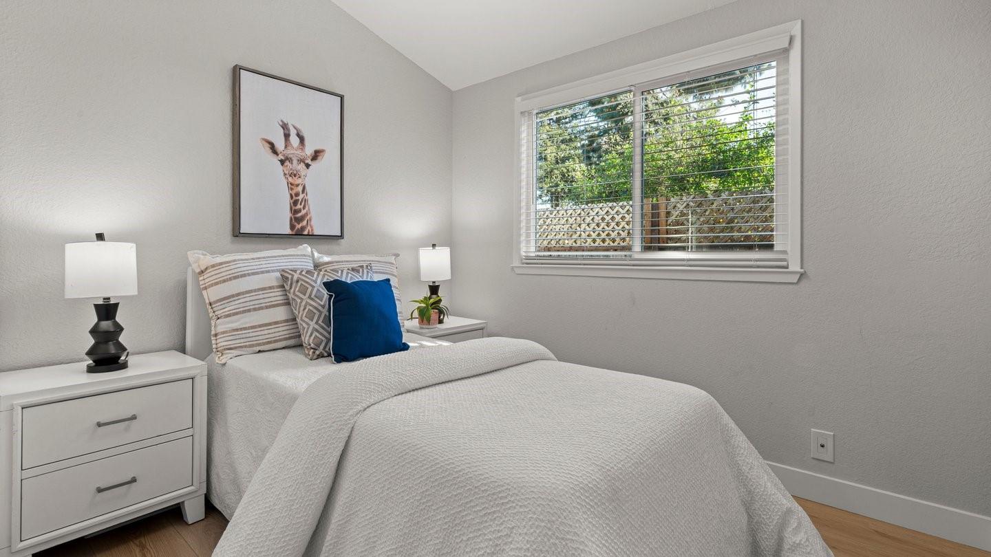 14355 La Rinconada Drive Los Gatos, CA 95032 - Photo 27 of 42 a bedroom with a bed and a window