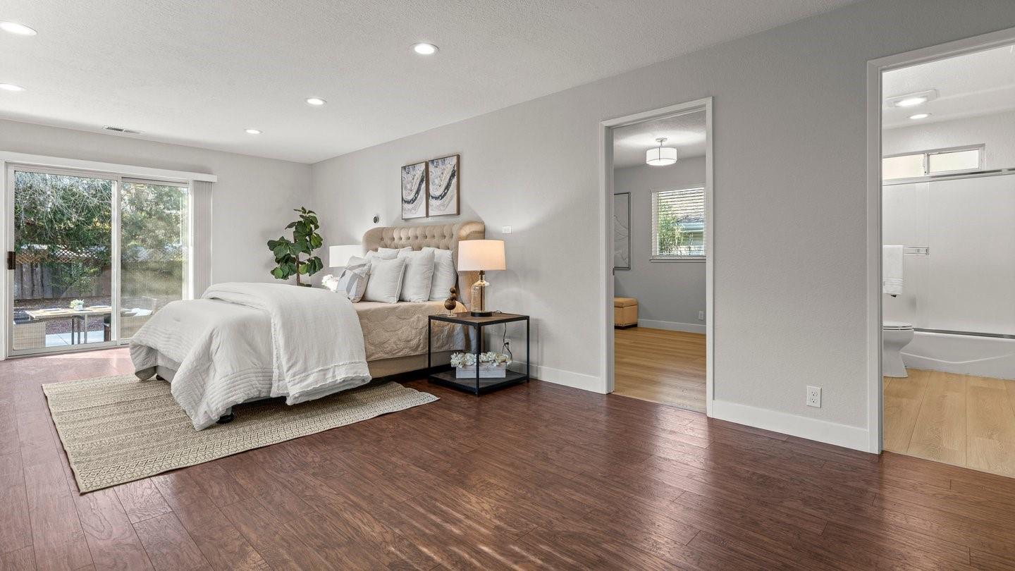 14355 La Rinconada Drive Los Gatos, CA 95032 - Photo 30 of 42 a bedroom with a bed and wooden floor