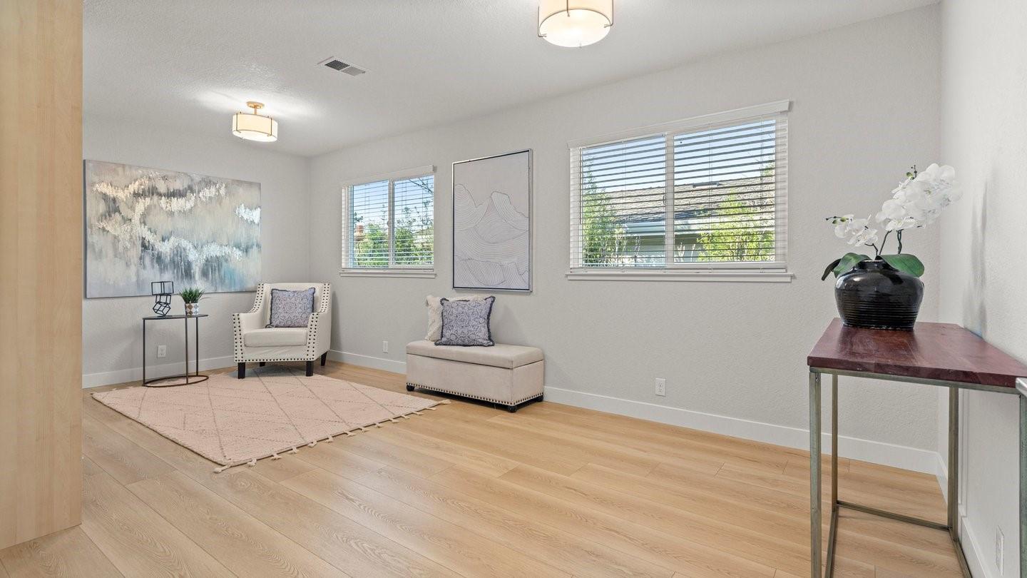 14355 La Rinconada Drive Los Gatos, CA 95032 - Photo 31 of 42 a living room with furniture and a potted plant
