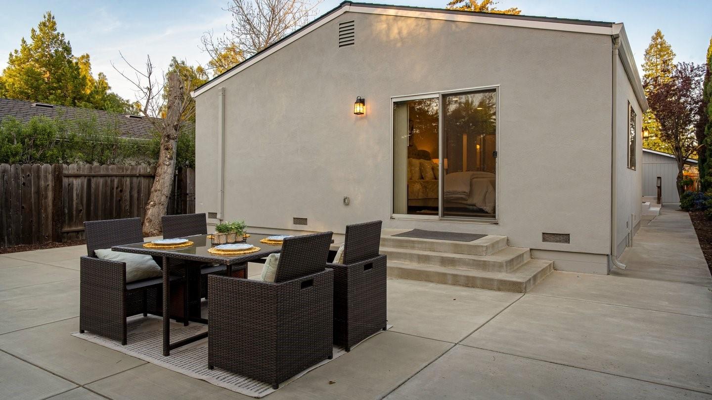 14355 La Rinconada Drive Los Gatos, CA 95032 - Photo 40 of 42 a view of a patio with a dining table and chairs