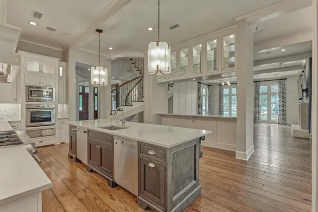 a kitchen with cabinets and window