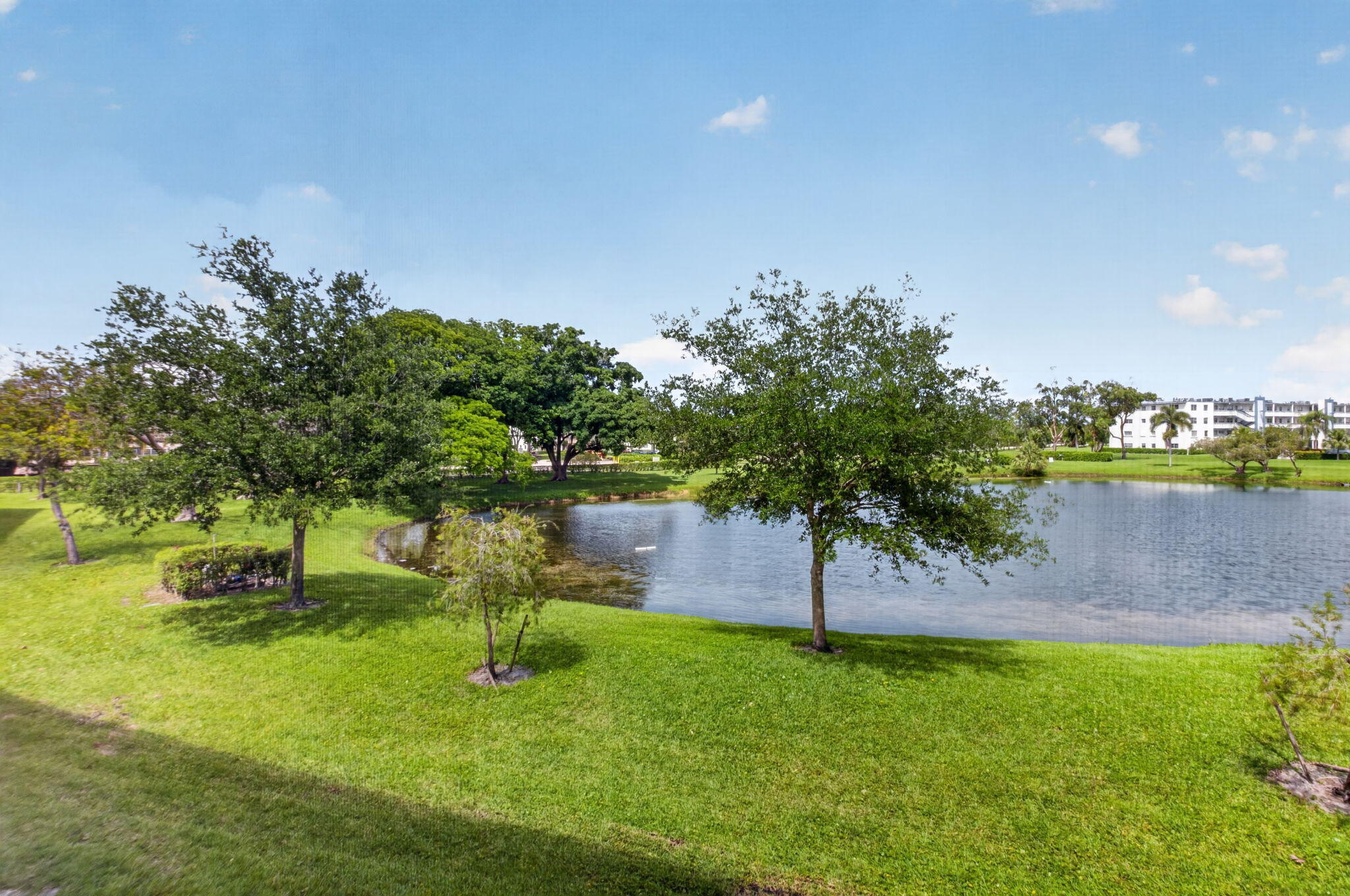 2047 Newcastle A Boca Raton, FL 33434 - Photo 24 of 57 Tranquil Lake & Tree View From Patio