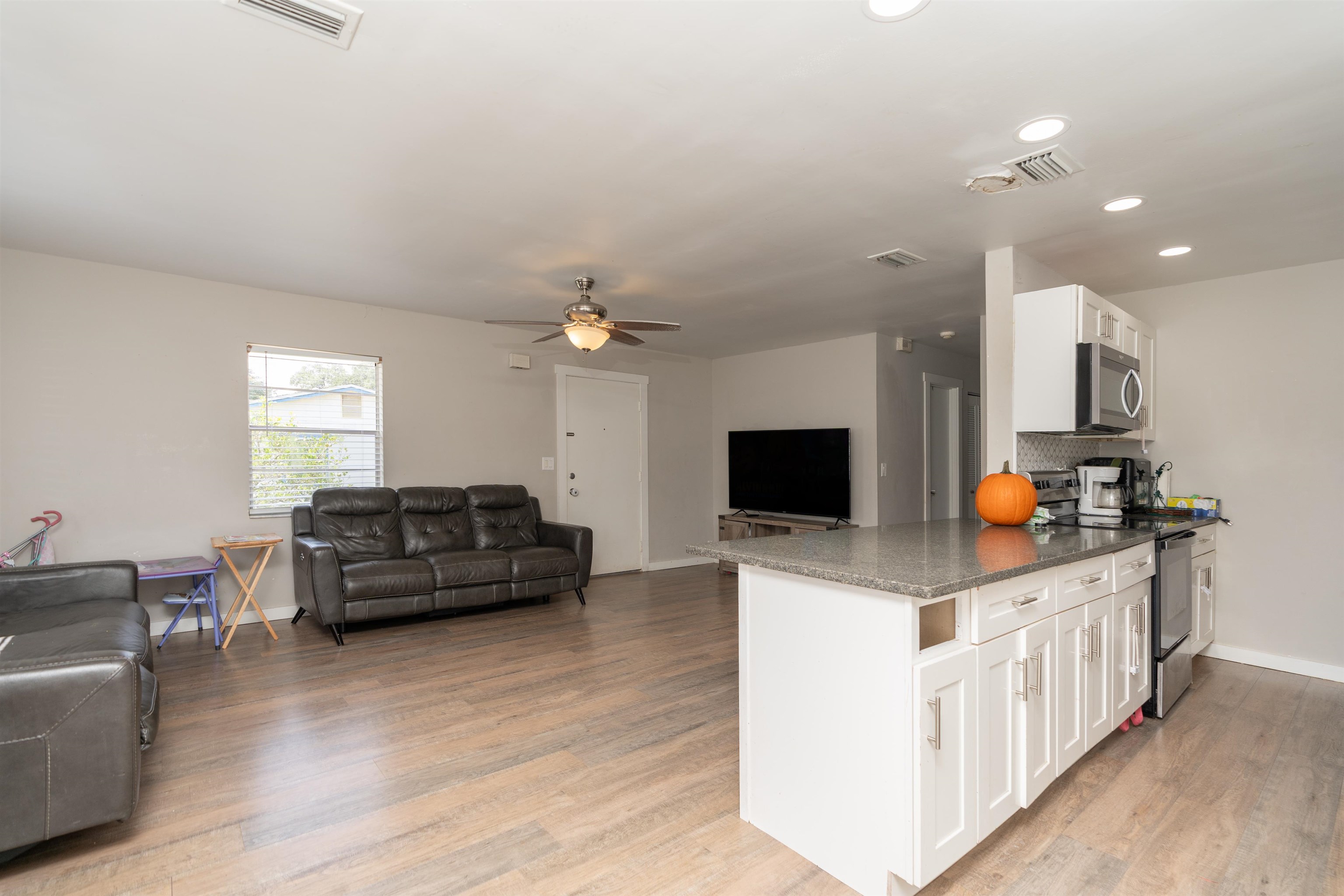 258 Costado Street St. Augustine, FL 32086 - Photo 14 of 39 a living room with furniture and a flat screen tv