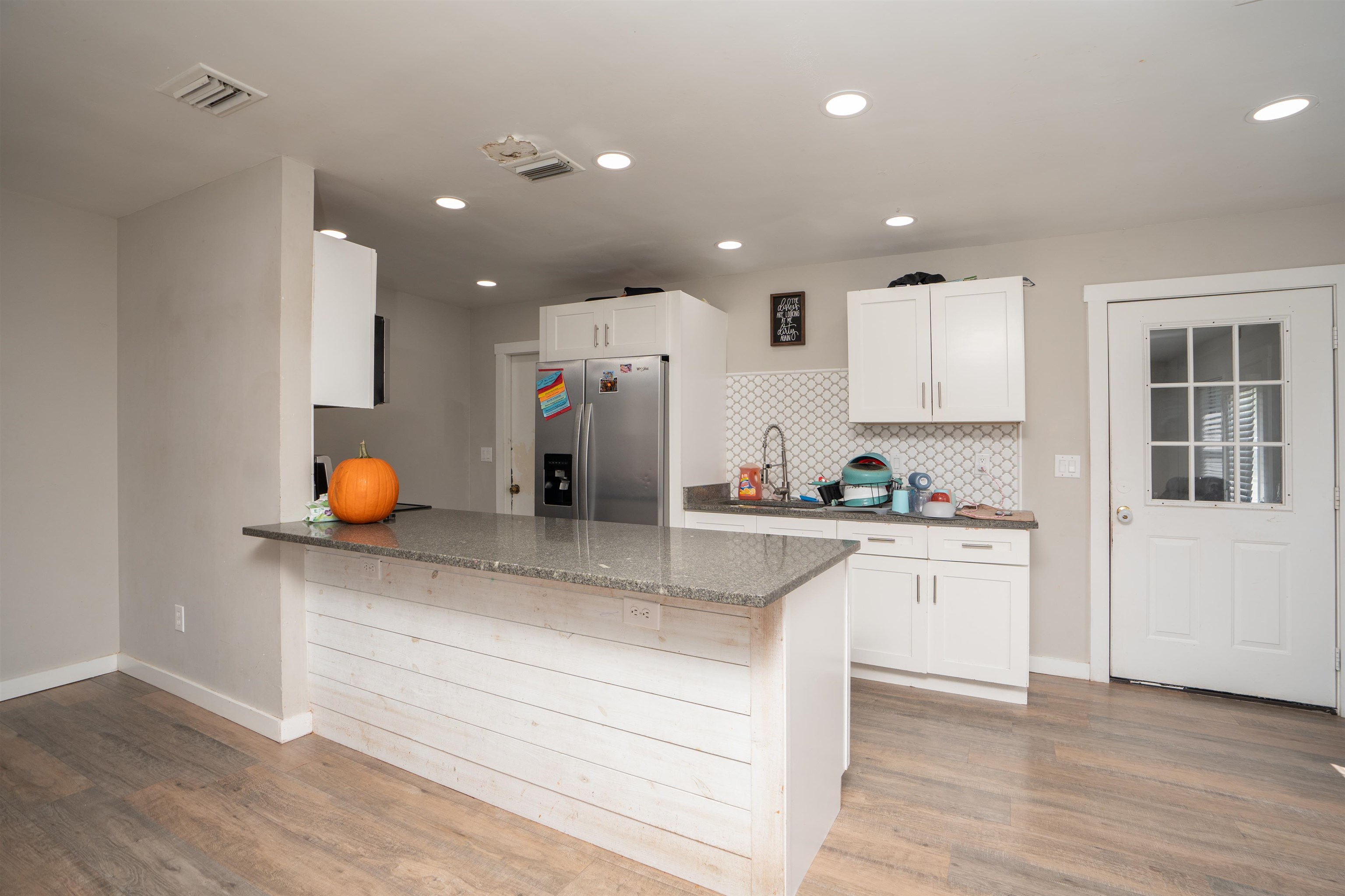 258 Costado Street St. Augustine, FL 32086 - Photo 15 of 39 a kitchen with stainless steel appliances granite countertop a sink and cabinets