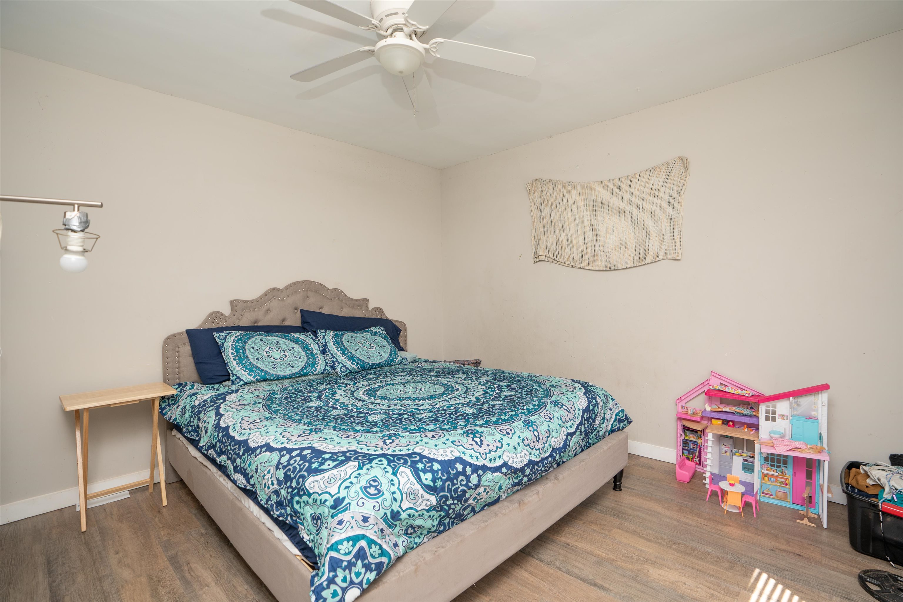 258 Costado Street St. Augustine, FL 32086 - Photo 22 of 39 a bedroom with a bed and a chandelier