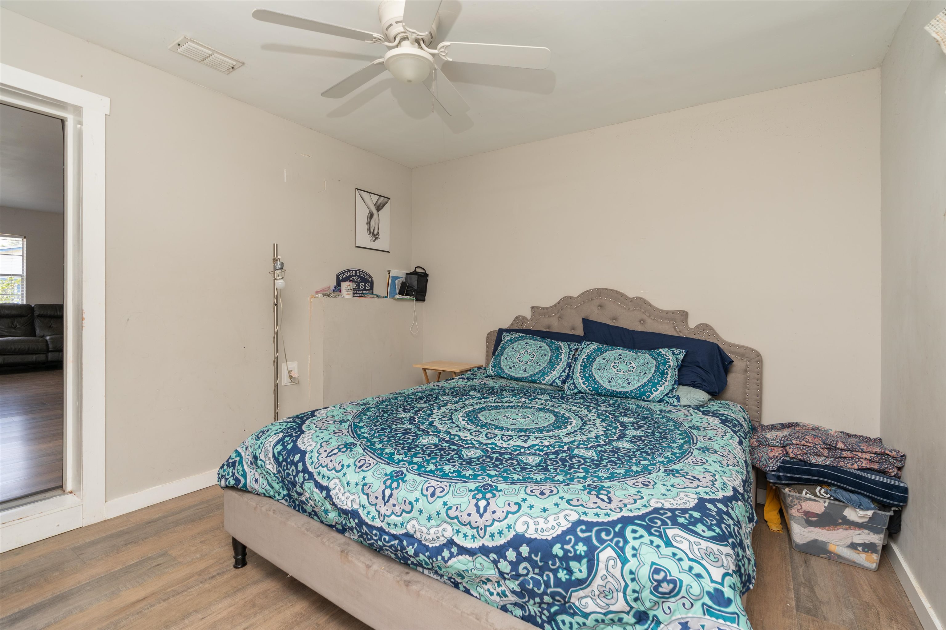 258 Costado Street St. Augustine, FL 32086 - Photo 23 of 39 a bedroom with a bed and a chandelier