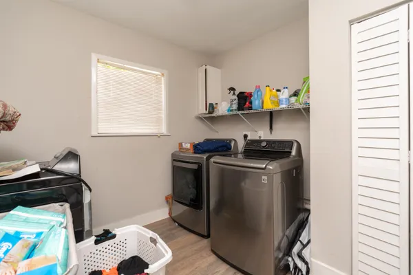 a sign that is sitting in front of flowers