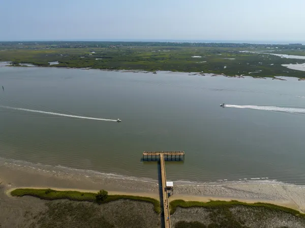an aerial view of a house with a swimming pool