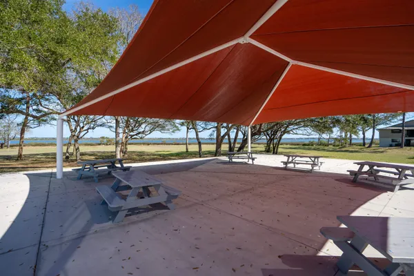 a view of a swimming pool with a patio