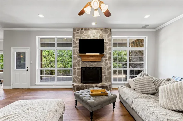 a living room with furniture and a fireplace