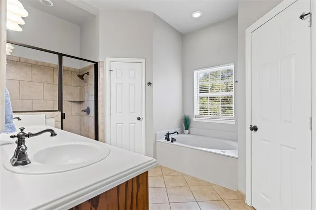 a bathroom with a bathtub and a sink