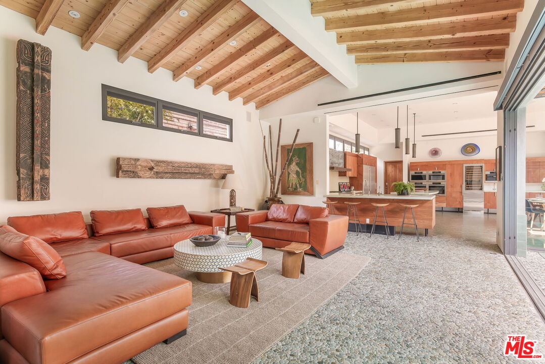345 West Channel Road Santa Monica, CA 90402 - Photo 11 of 35 a living room with furniture and a large window