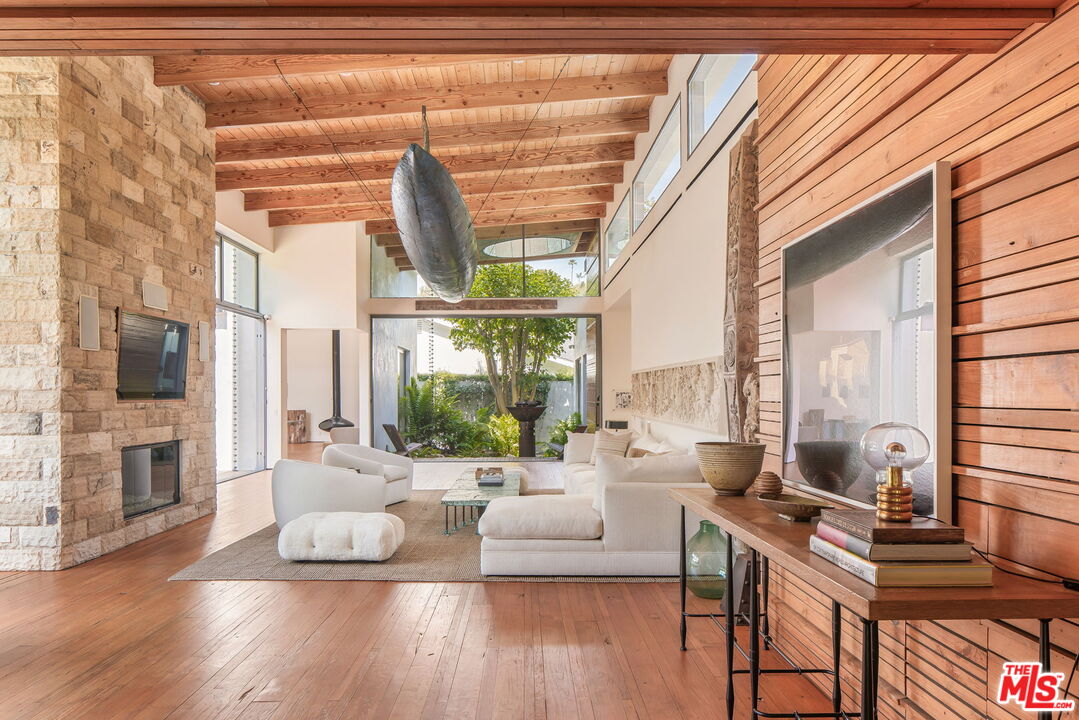 345 West Channel Road Santa Monica, CA 90402 - Photo 12 of 35 a living room with furniture and a large window