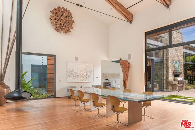 a view of living room with furniture and floor to ceiling windows