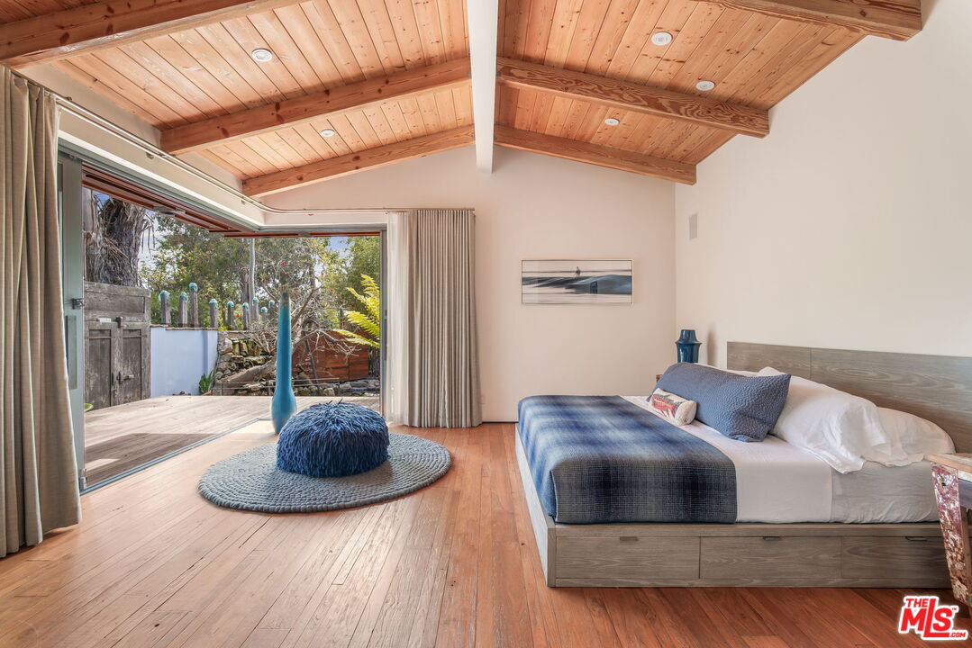 345 West Channel Road Santa Monica, CA 90402 - Photo 21 of 35 a living room with furniture and a floor to ceiling window