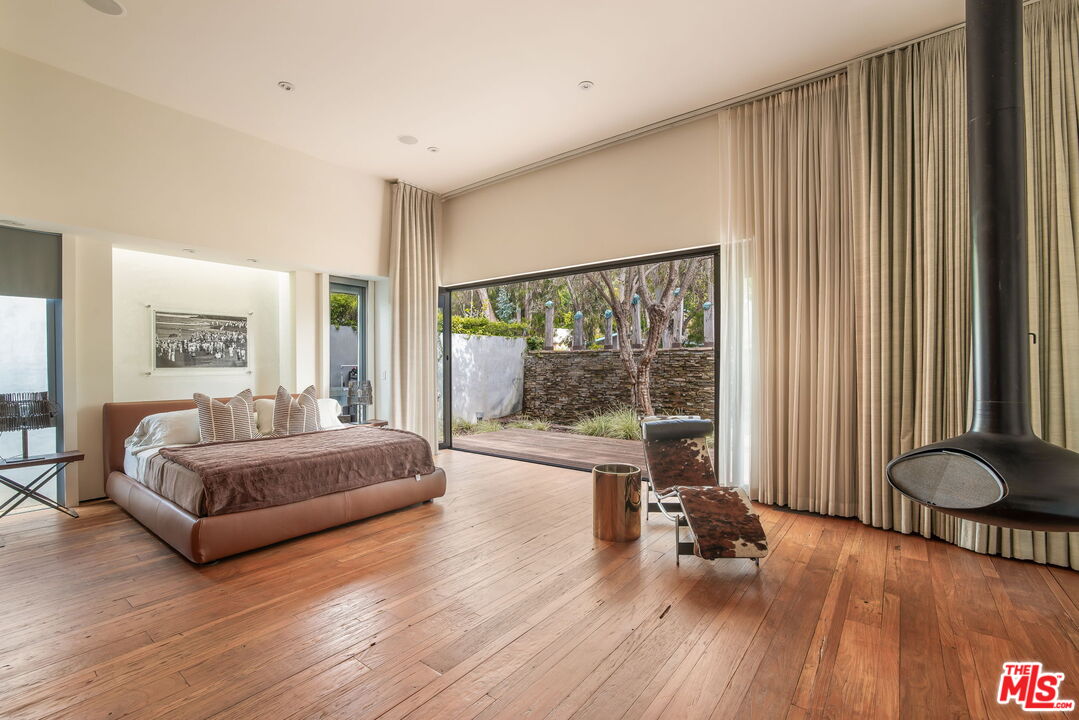 345 West Channel Road Santa Monica, CA 90402 - Photo 22 of 35 a living room with furniture and a large window