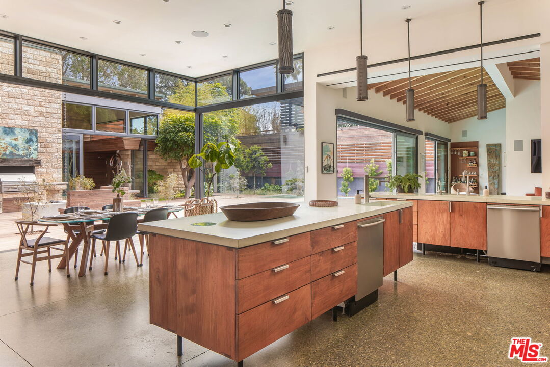 345 West Channel Road Santa Monica, CA 90402 - Photo 6 of 35 a kitchen with a large window and cabinets
