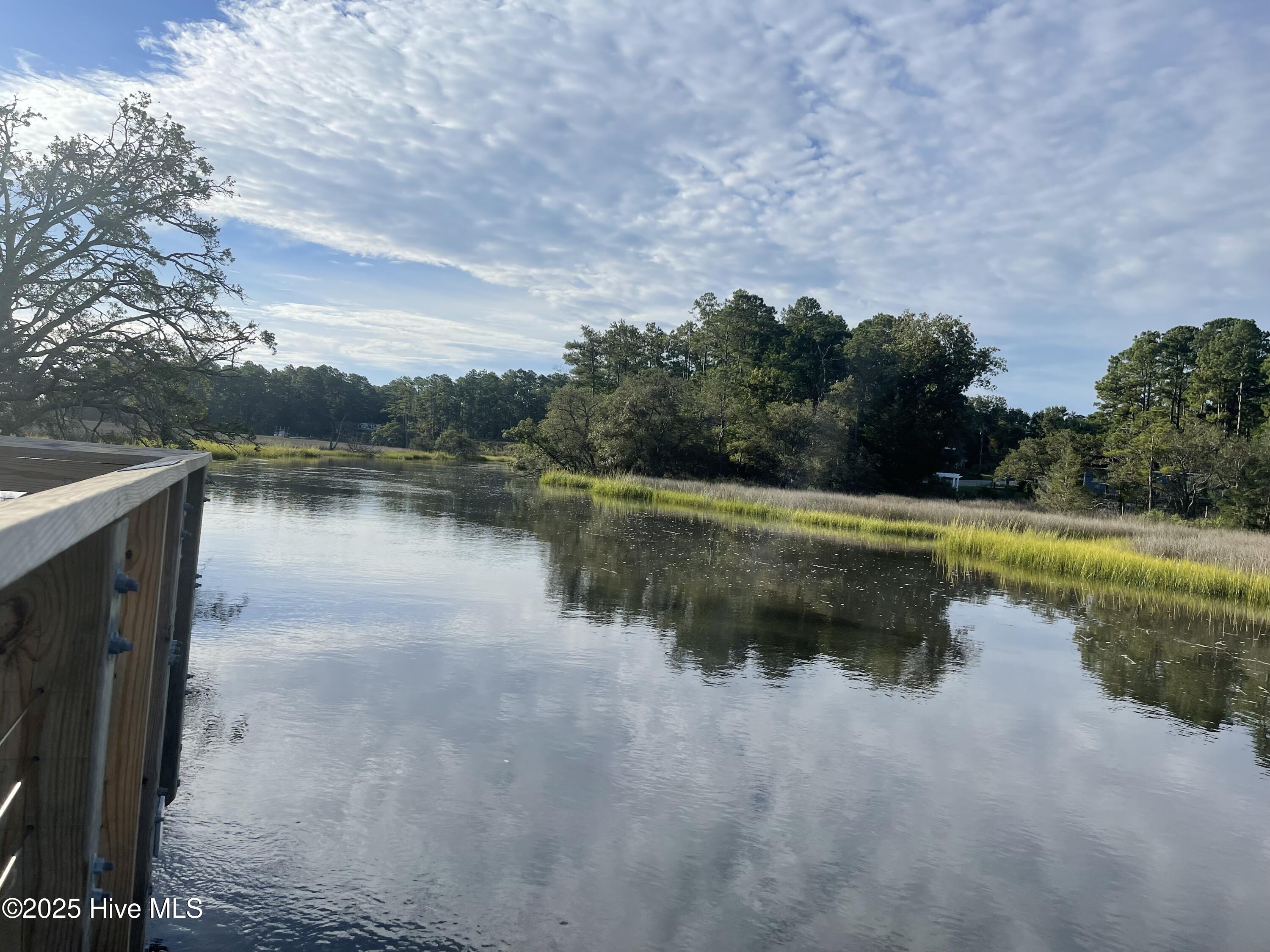 396 Deer Path Calabash, NC 28467 - Photo 30 of 33 The Riverwalk features a quarter-mile boardwalk with a gazebo at each end, offering stunning views of the Shallotte River.