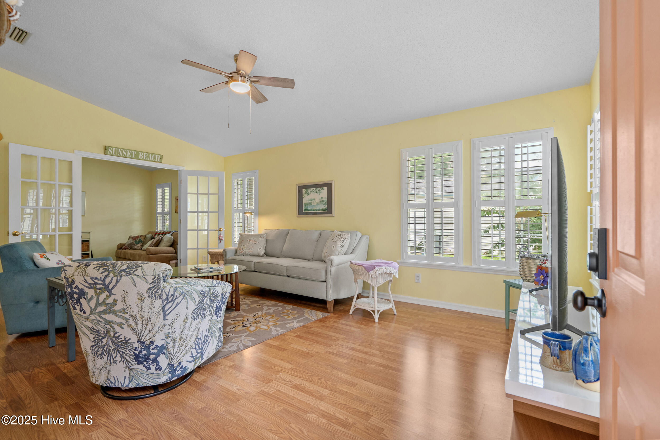 396 Deer Path Calabash, NC 28467 - Photo 3 of 33 Entering the front door, this spacious living area is conducive to hosting gatherings and entertaining guests. It becomes the heart of social interactions, accommodating friends and family comfortably. Whether it's a lively party, a cozy family movie night, or a quiet evening of introspection, the expansiveness of this living area ensures that there's room for every occasion.