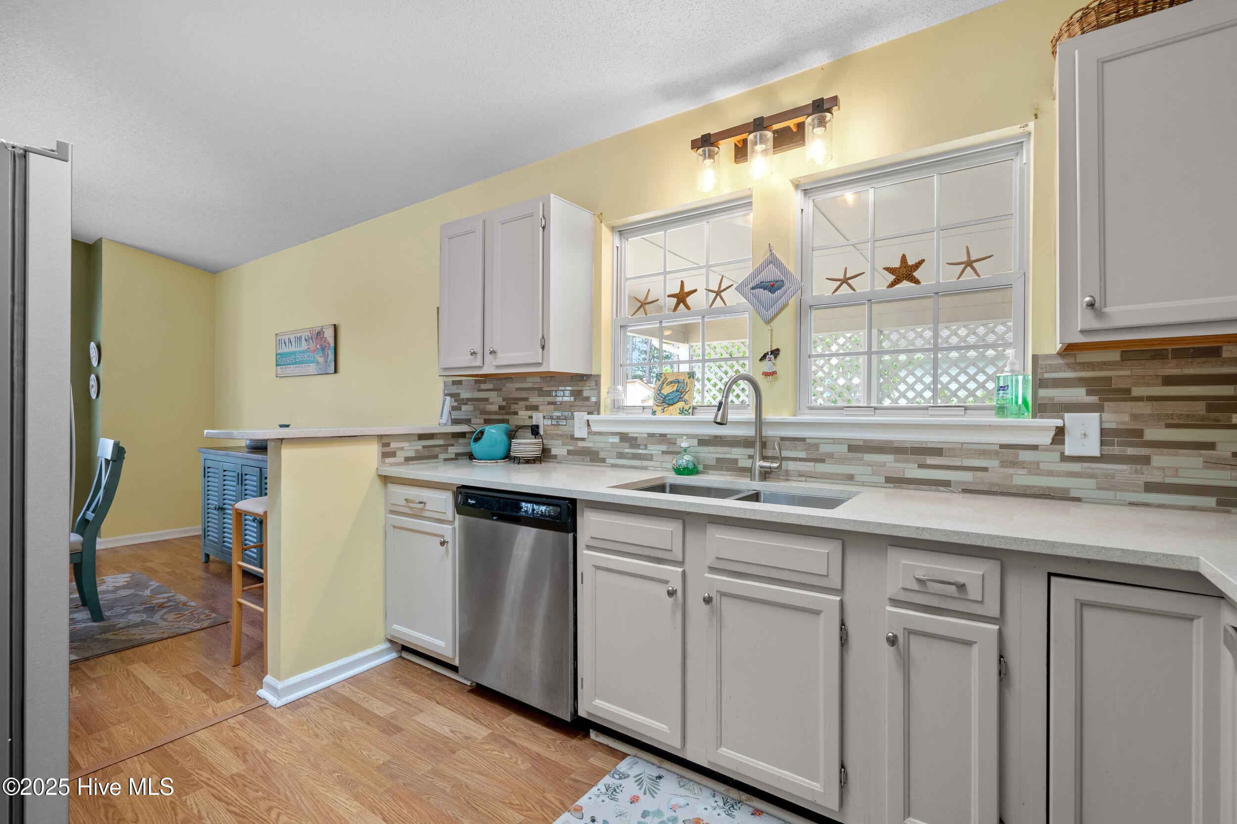 396 Deer Path Calabash, NC 28467 - Photo 8 of 33 The proximity of the dining room to the kitchen ensures that meals are not just about nourishment but also about shared experiences. It fosters a sense of togetherness, allowing family members and guests to easily transition from the culinary hub to a dedicated space for dining and conversation.