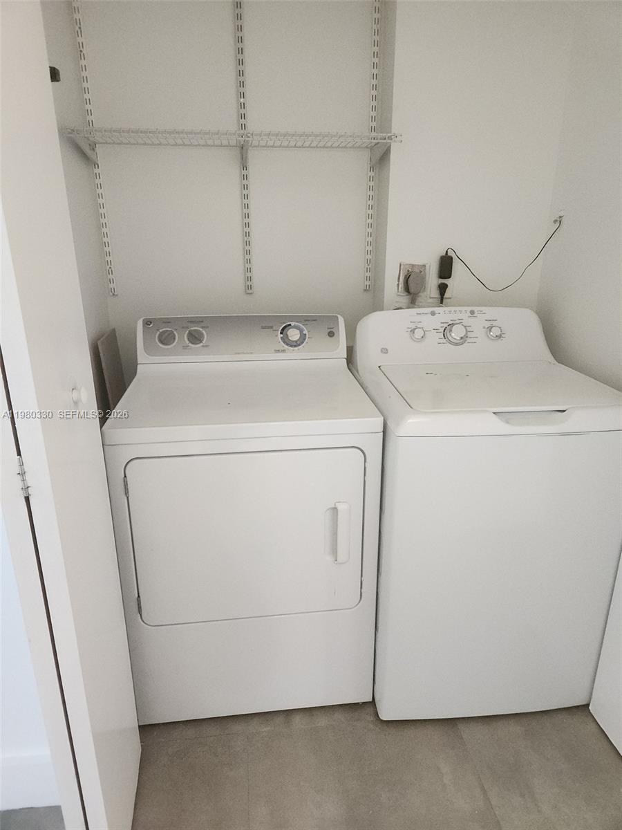 9441 Southwest 4th Street, Unit 302 Miami, FL 33174 - Photo 12 of 24 a utility room with dryer and washer