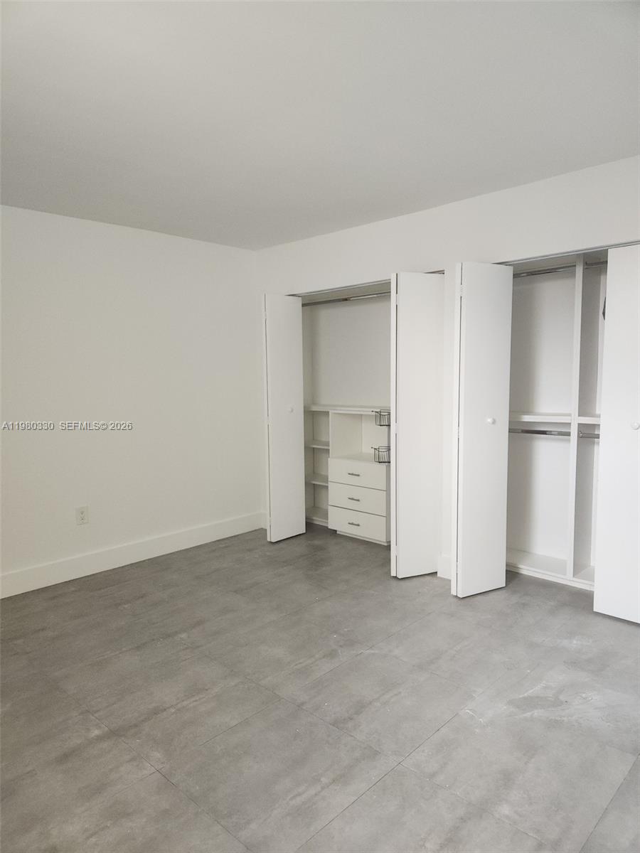 9441 Southwest 4th Street, Unit 302 Miami, FL 33174 - Photo 22 of 24 an empty room with an empty space