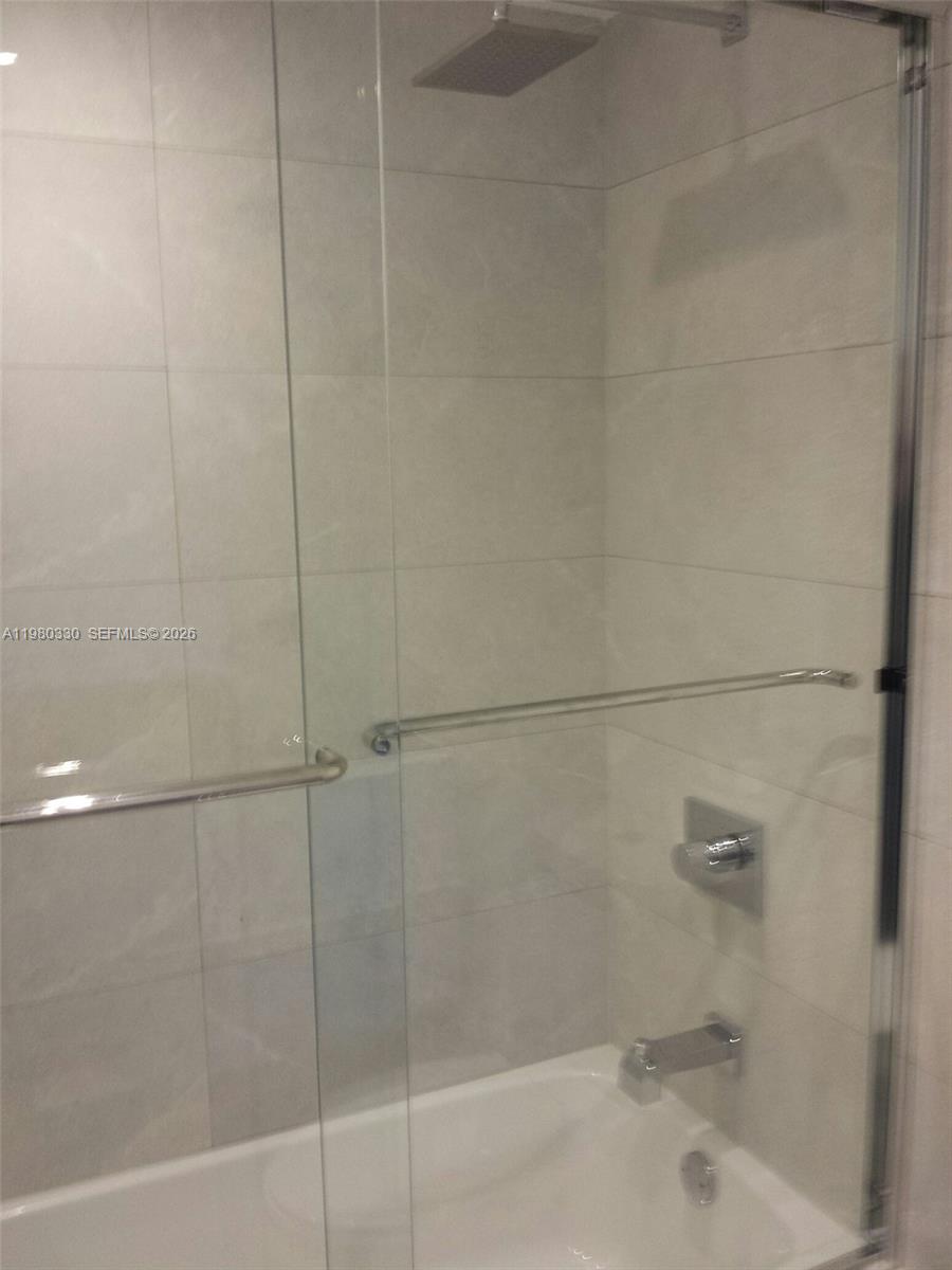 9441 Southwest 4th Street, Unit 302 Miami, FL 33174 - Photo 5 of 24 a bathroom with a shower