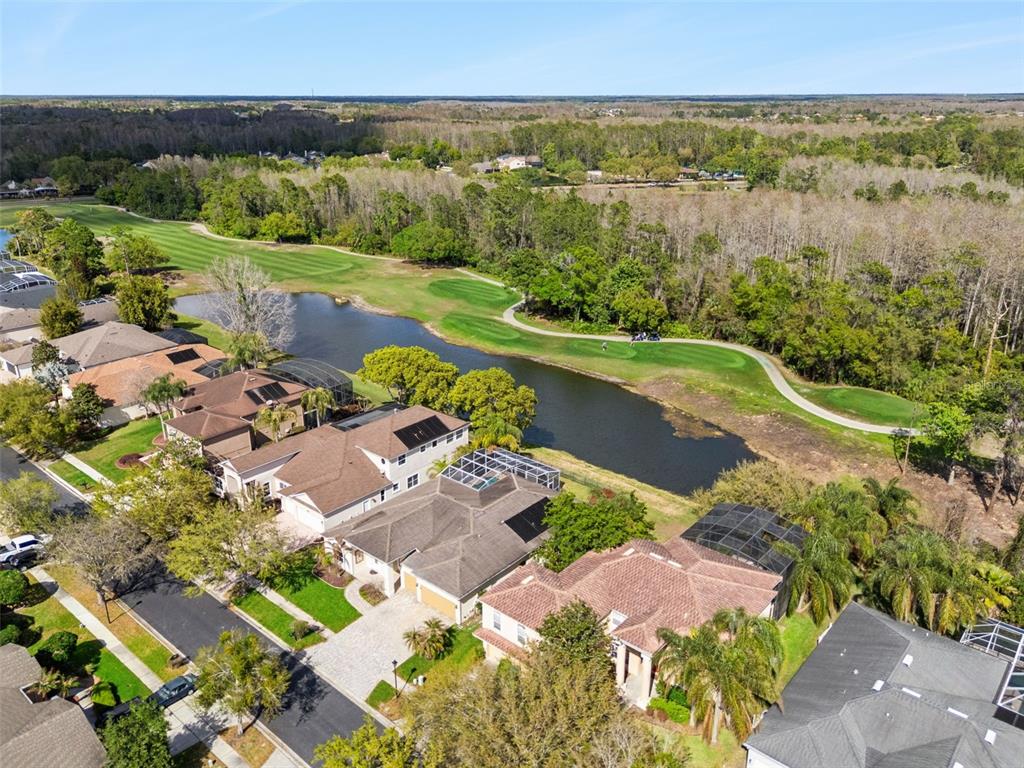 2541 Teton Stone Run Orlando, FL 32828 - Photo 63 of 82 an aerial view of lake residential house with outdoor space and trees around