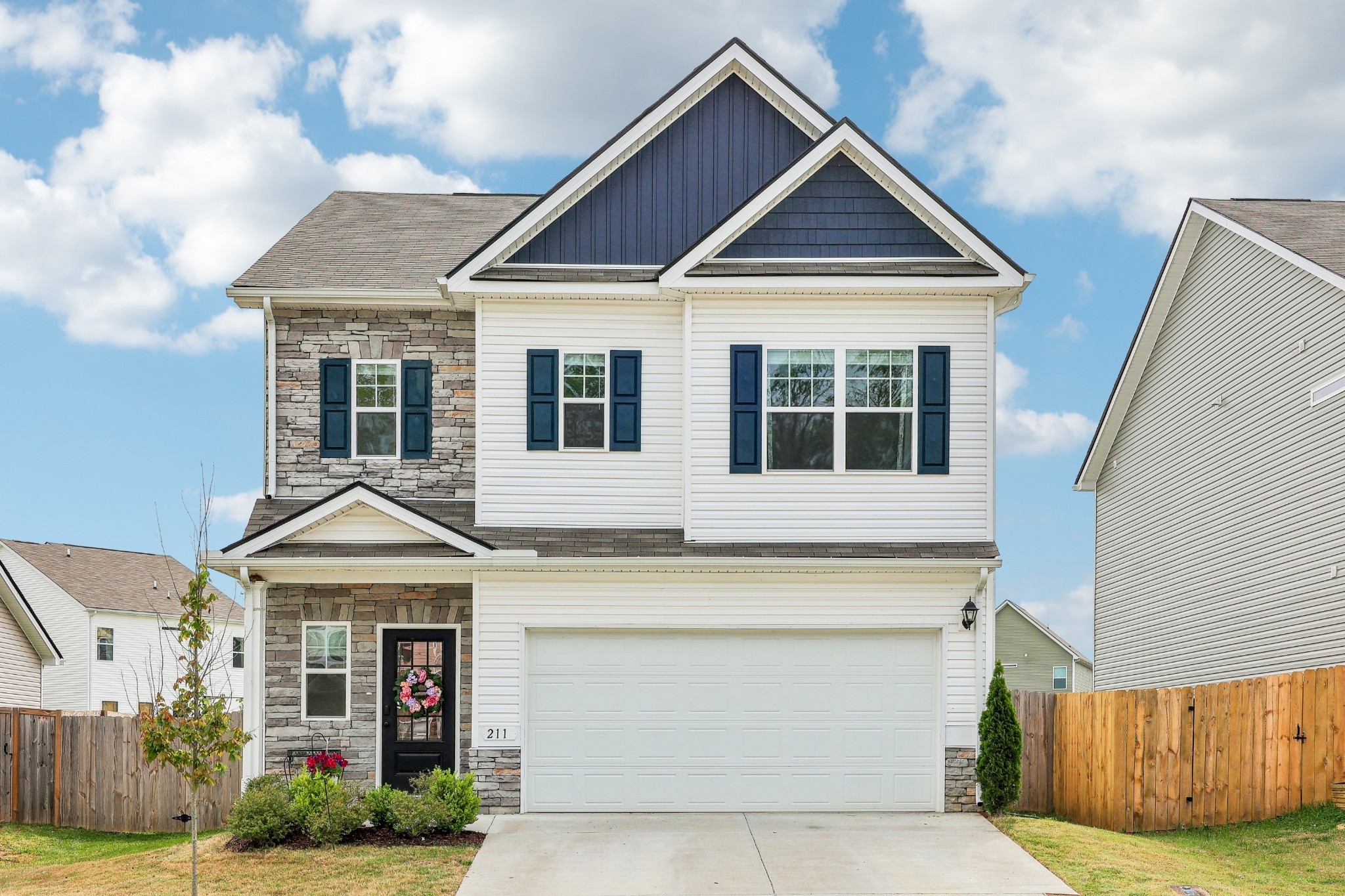 211 Hanson Lane Columbia, TN 38401 - Photo 1 of 35 a front view of a house with garden