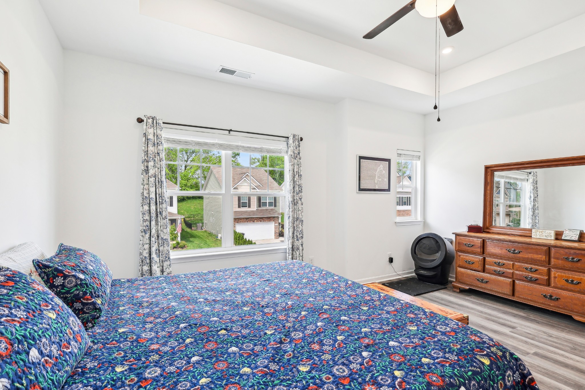211 Hanson Lane Columbia, TN 38401 - Photo 19 of 35 a bedroom with a bed and a chandelier