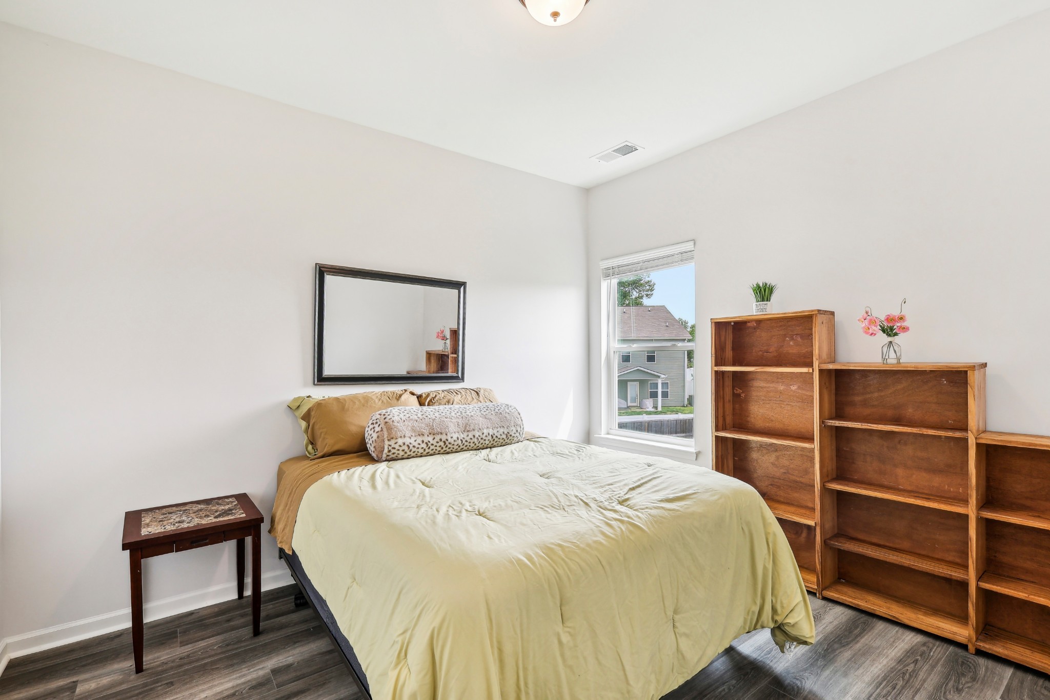 211 Hanson Lane Columbia, TN 38401 - Photo 27 of 35 a bedroom with a bed and walk in closet with wooden floor