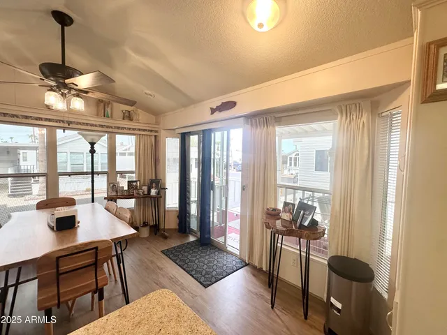 a kitchen with granite countertop wooden floor and stainless steel appliances
