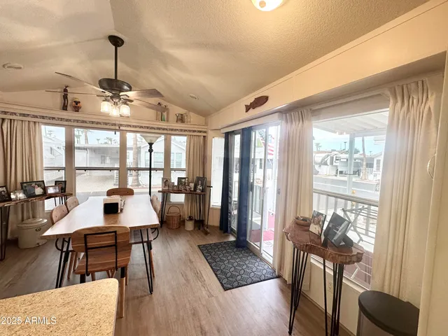 a kitchen with granite countertop a sink a stove and cabinets