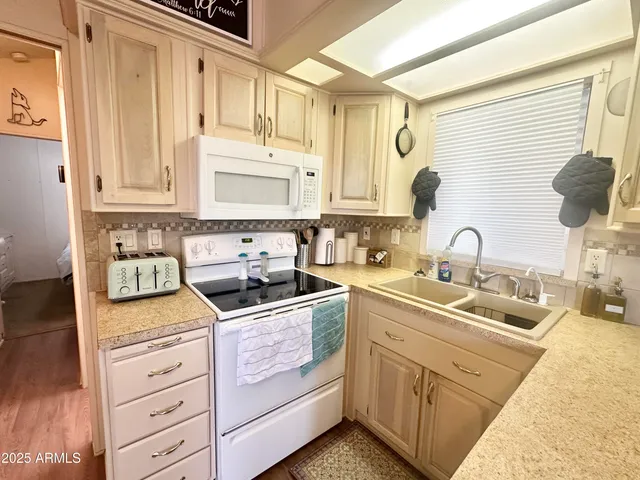 a bathroom with a sink toilet a mirror and shower
