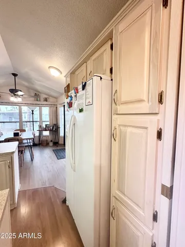 a bedroom with two beds and a lamp with window