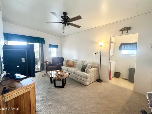 a view of a patio with table and chairs