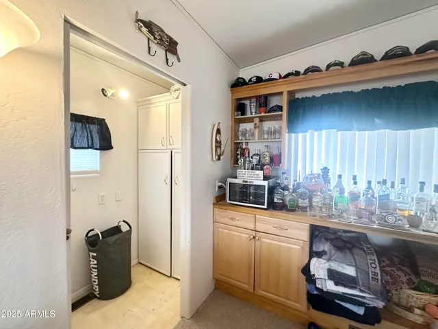 a front view of a house with a yard and tree s