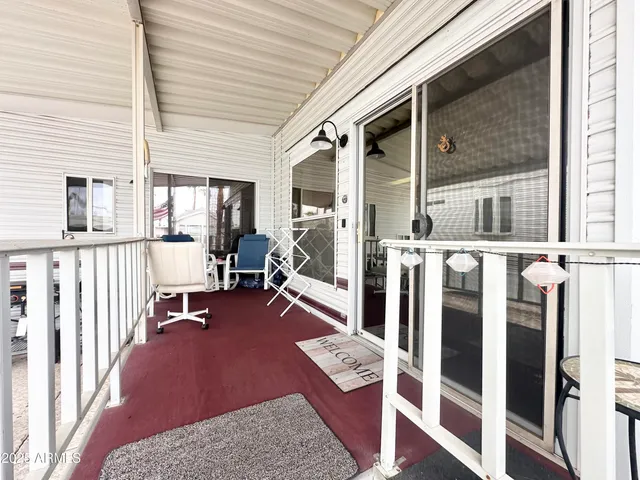 a living room with stainless steel appliances kitchen island granite countertop furniture and a kitchen view