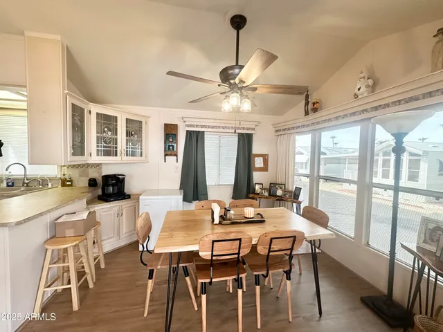 a view of a dining room with furniture window and outside view