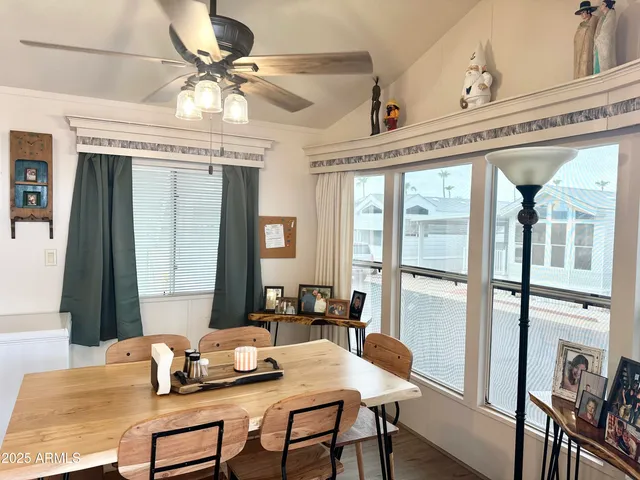 a bedroom with furniture and large windows