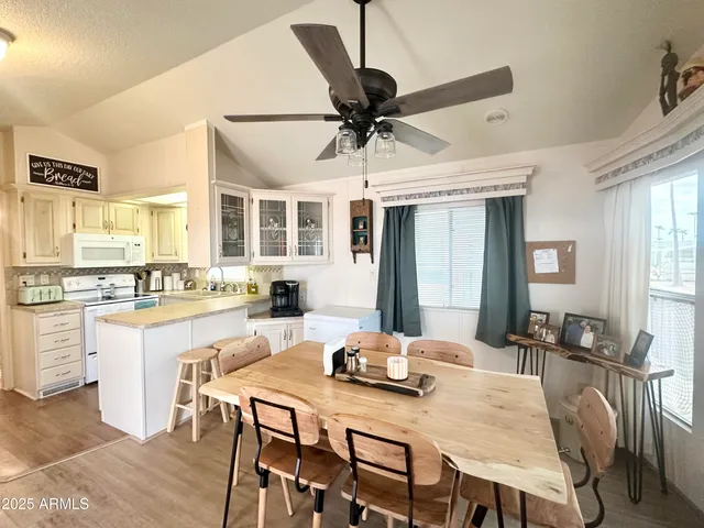 a view of a hallway and a livingroom with furniture