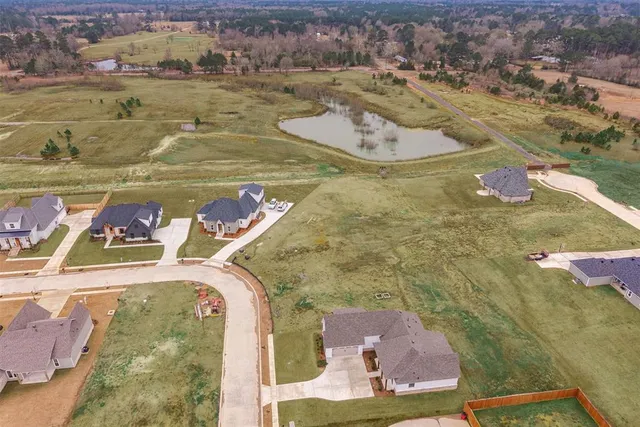 an aerial view of a house with a ocean view