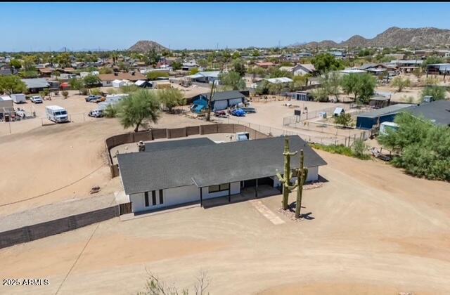 604 North 101st Place Mesa, AZ 85207 - Photo 2 of 2 an aerial view of a house with a swimming pool and mountain view