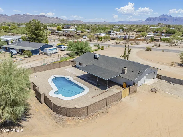 an aerial view of a residential houses with outdoor space
